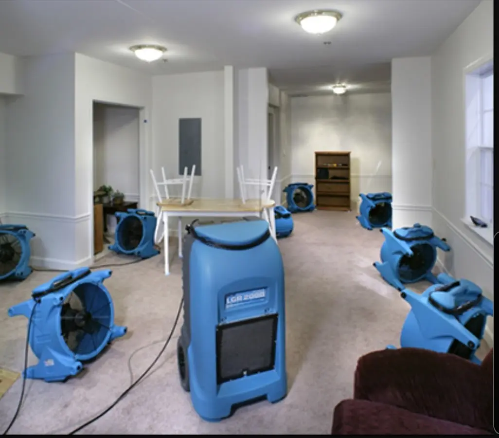 Air movers and dehumidifier setup for Water Damage Restoration in Wallington